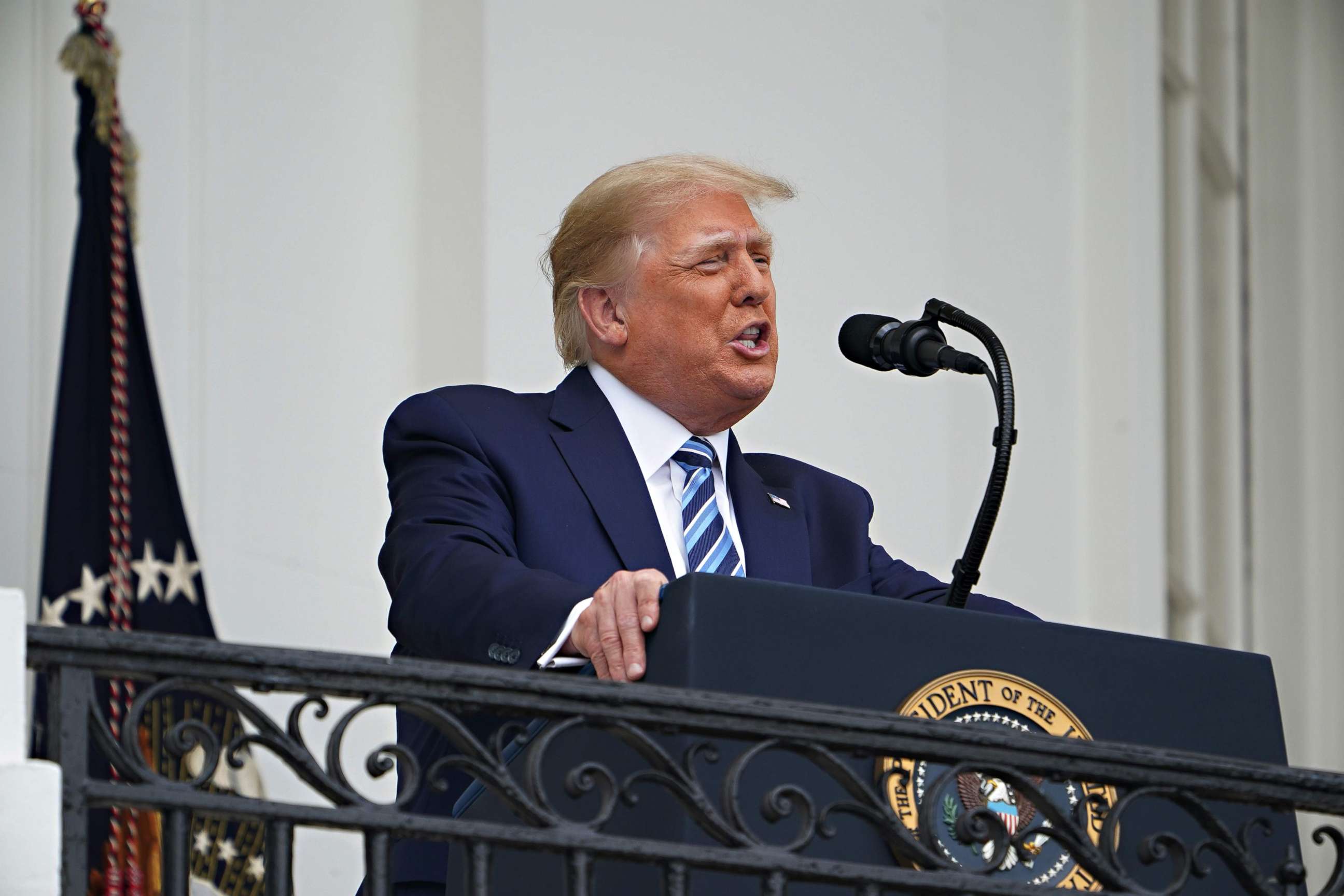 President Donald Trump visits and speaks with workers as he is