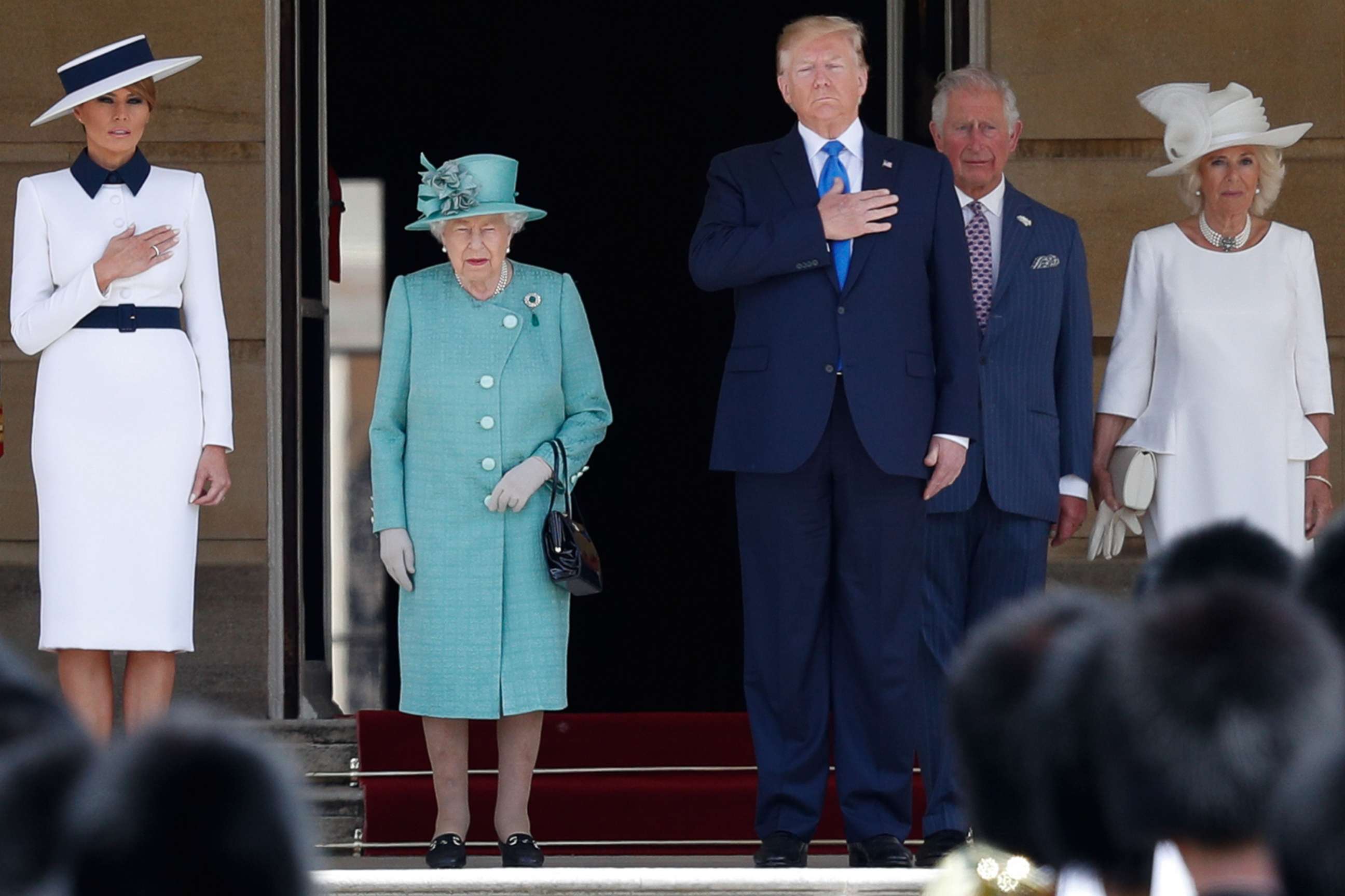 First lady Melania Trump, Britain's Queen Elizabeth II, President Donald Trump, Britain's Prince Charles, Prince of Wales and Britain's Camilla, Duchess of Cornwall stand on the steps during a welcome ceremony at Buckingham Palace in London, June 3, 2019.