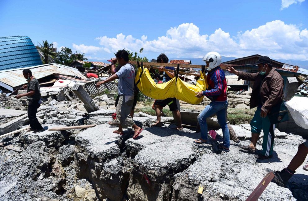 PHOTO: Villagers carry the body of a victim following earthquakes and tsunami in Palu, Central Sulawesi, Indonesia, Sept. 30, 2018. 