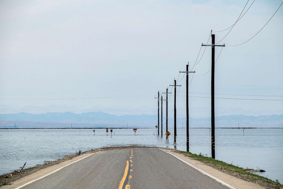 PHOTO: Flooded road is shown near Tulare Lake, located in California's Central Valley, on June 6, 2023.