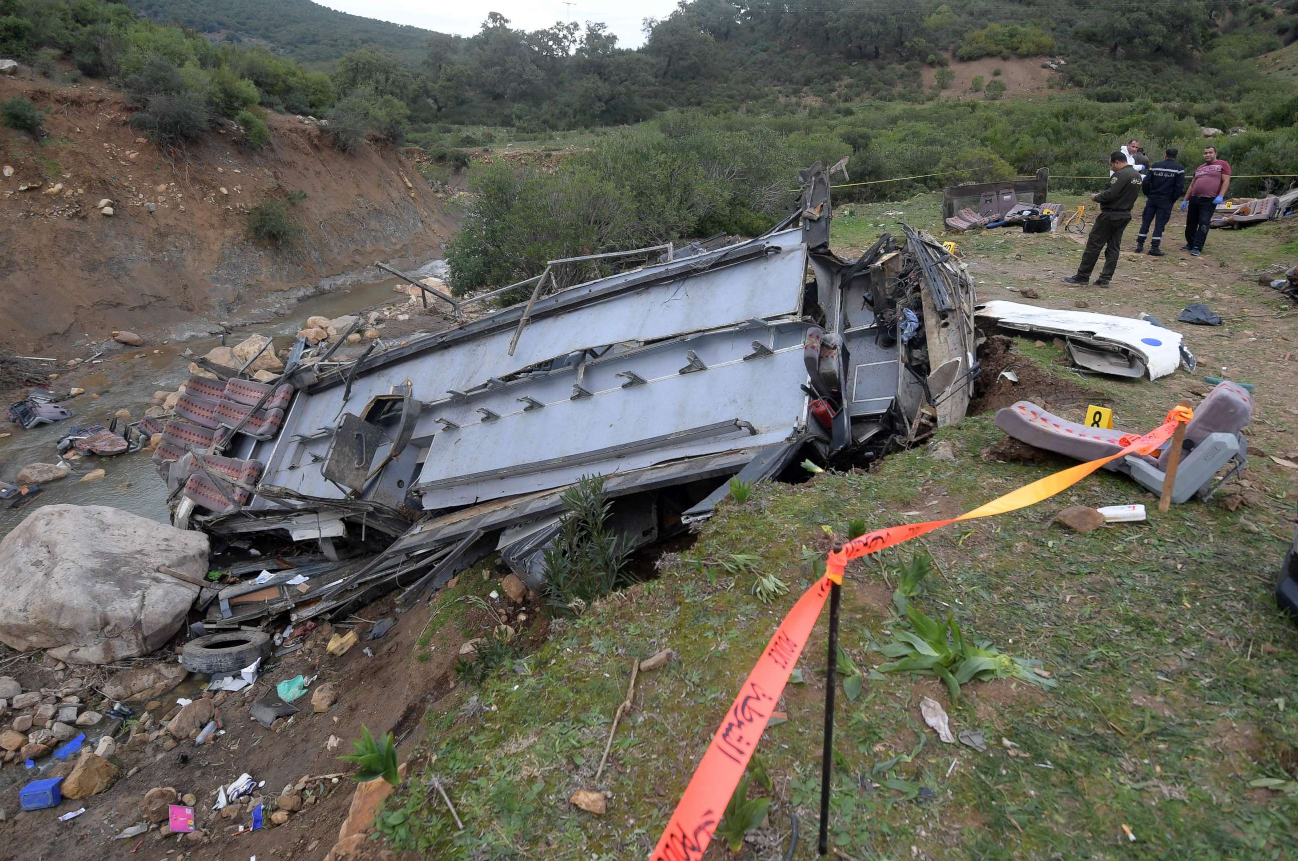 PHOTO: Tunisian authorities check the debris of a bus that plunged over a cliff into a ravine in Ain Snoussi in northern Tunisia on Dec. 1, 2019.