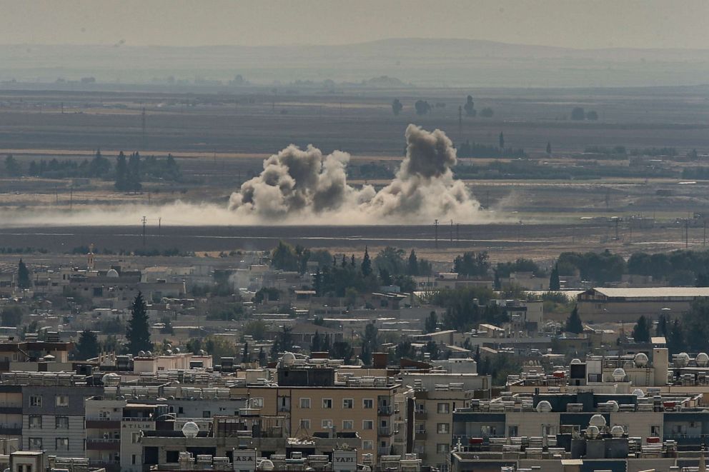 PHOTO: In this photo taken from the Turkish side of the border between Turkey and Syria, in southeastern Turkey, smoke billows from fires on targets in Ras al-Ayn, Syria, caused by bombardment by Turkish forces, Oct. 13, 2019.