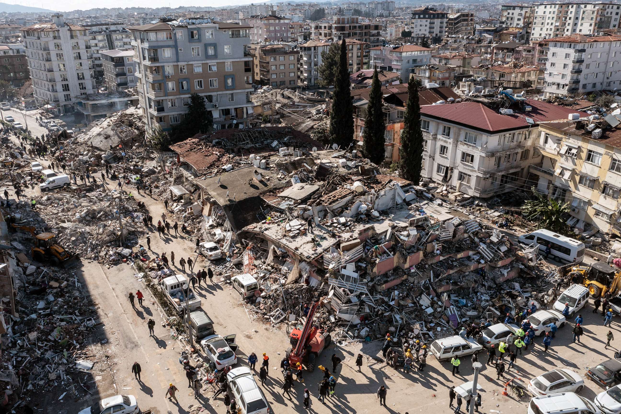PHOTO: People gather around collapsed buildings, Feb. 08, 2023 in Hatay, Turkey.