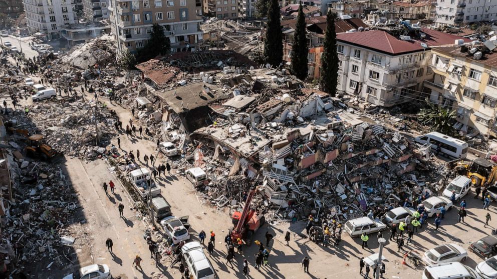 PHOTO: People gather around collapsed buildings, Feb. 08, 2023 in Hatay, Turkey.