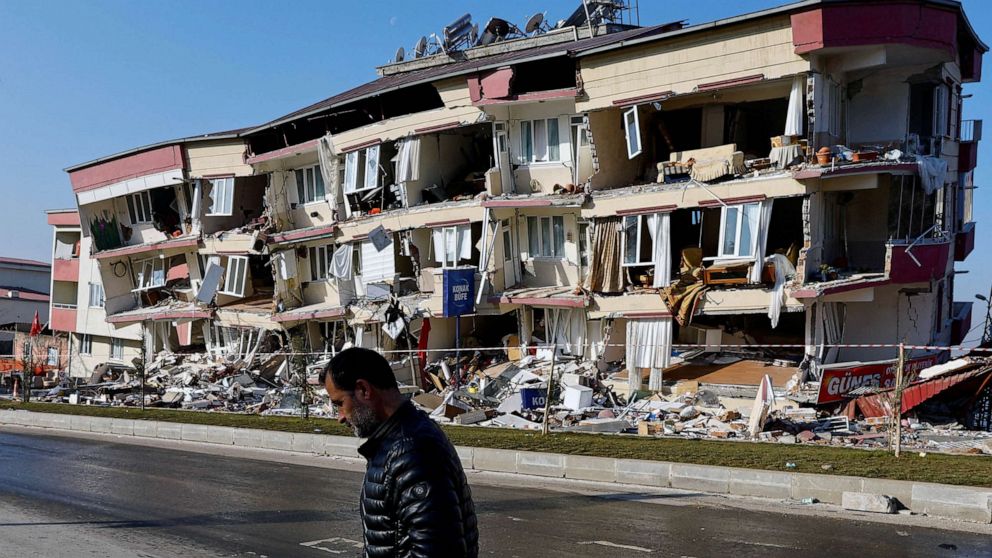 PHOTO: A man walks past a damaged building in the aftermath of a deadly earthquake in Kahramanmaras, Turkey, Feb. 13, 2023.