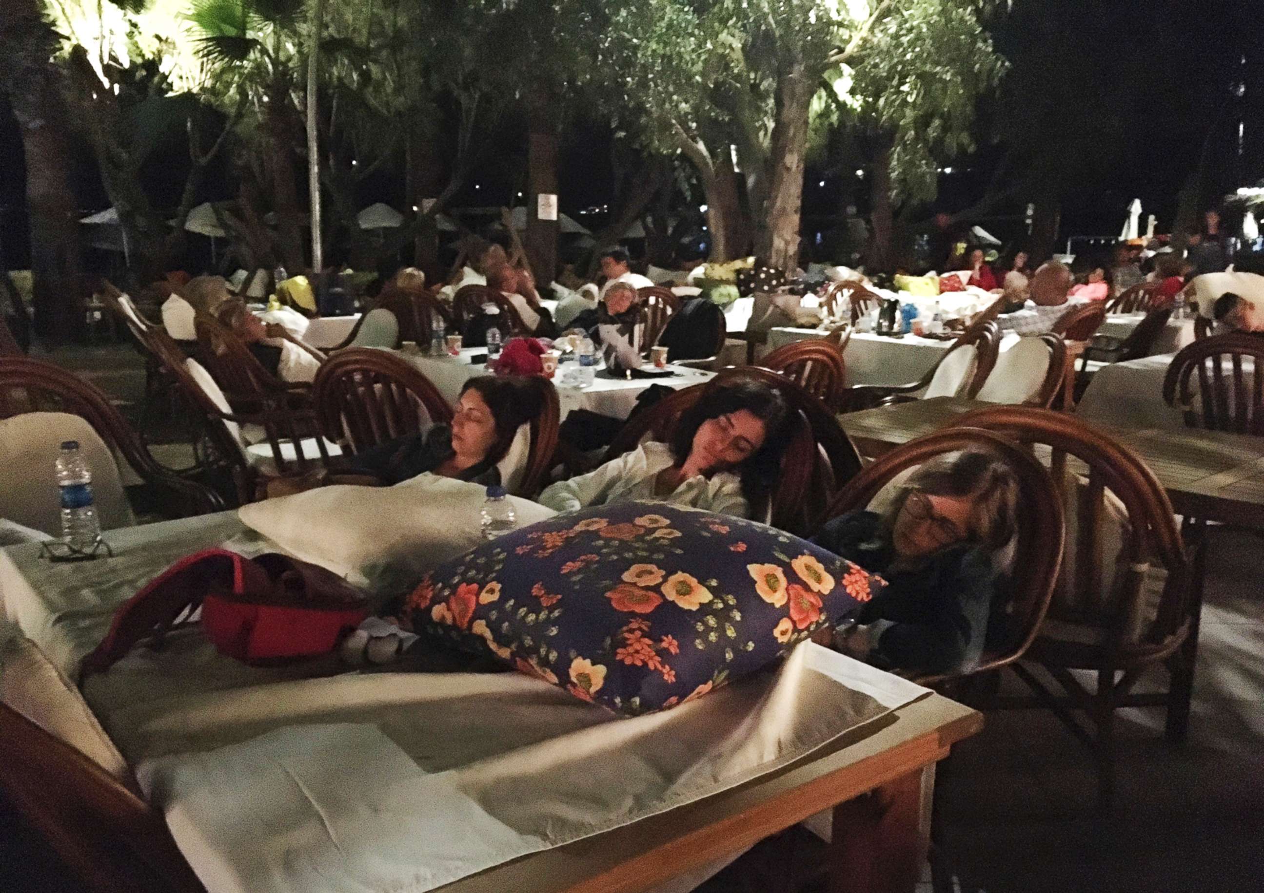 PHOTO: Hotel guests sleep outdoors after abandoning their rooms following an earthquake in Bitez, a resort town about 4 miles west of Bodrum, Turkey, early Friday, July 21, 2017.