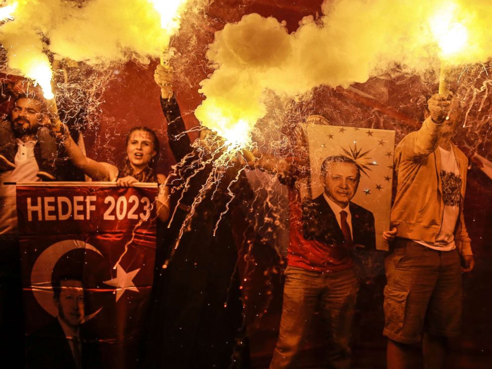 PHOTO: Supporters of Turkeys President and ruling Justice and Development Party, or AKP, leader Recep Tayyip Erdogan light flares during celebrations outside the party headquarters in Istanbul, June 24, 2018.