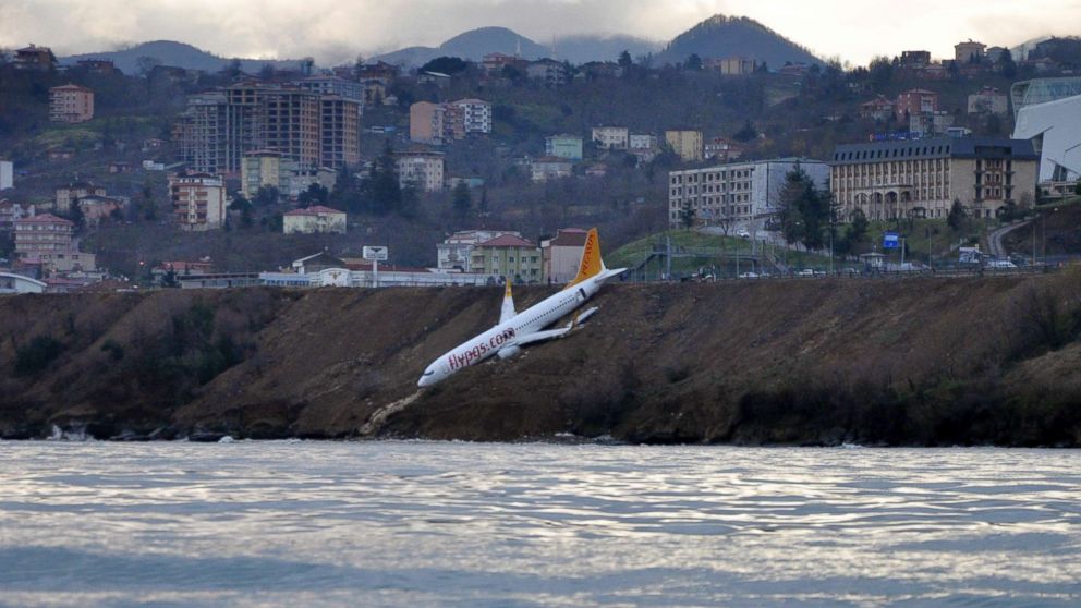PHOTO: A Boeing 737-800 of Turkey's Pegasus Airlines is pictured after skidding off the runway downhill towards the sea at the airport in Trabzon, Turkey, Jan. 14, 2018. 