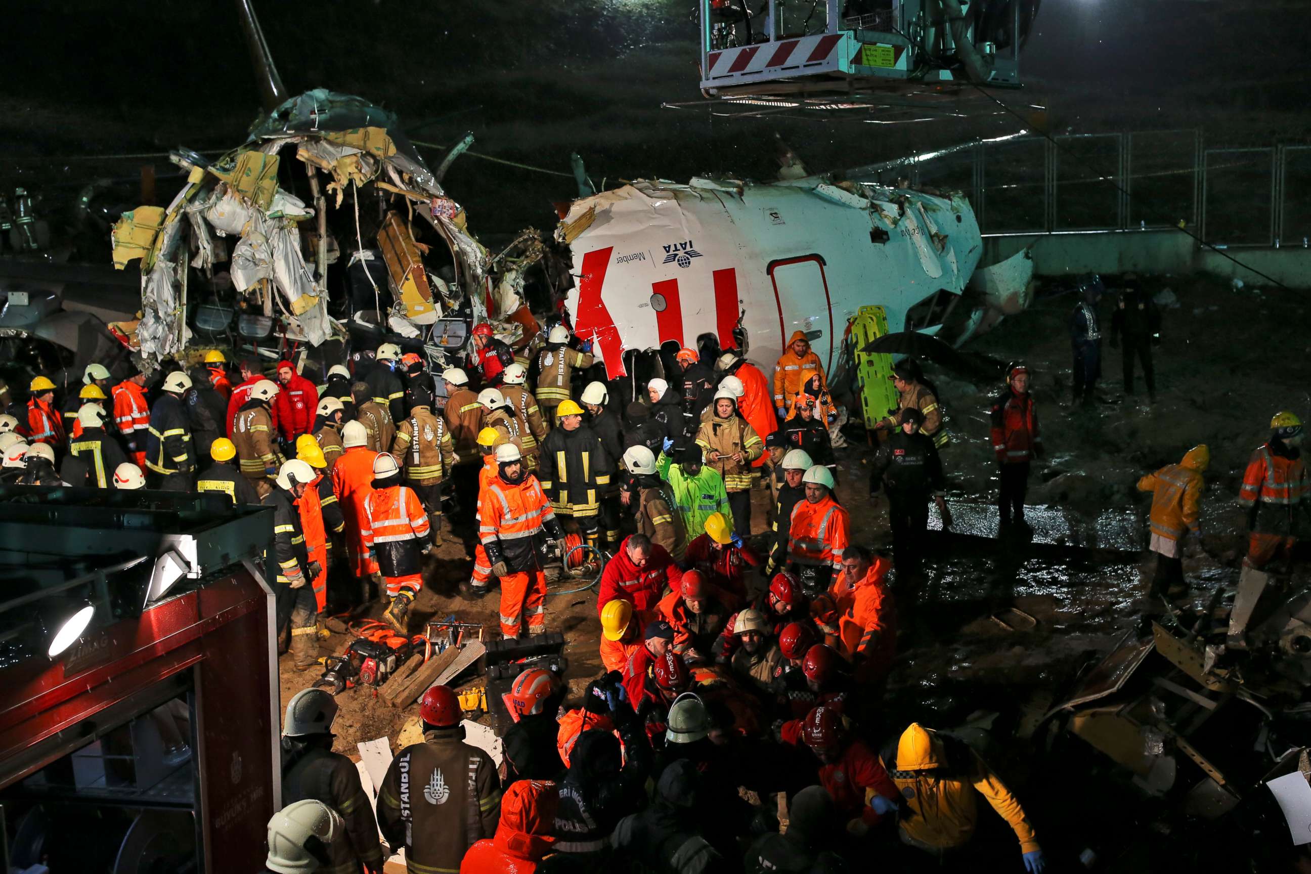 PHOTO: Rescue members evacuate an injured person from the wreckage of a plane after it skidded off the runway at Istanbul's Sabiha Gokcen Airport, in Istanbul, Wednesday, Feb. 5, 2020.