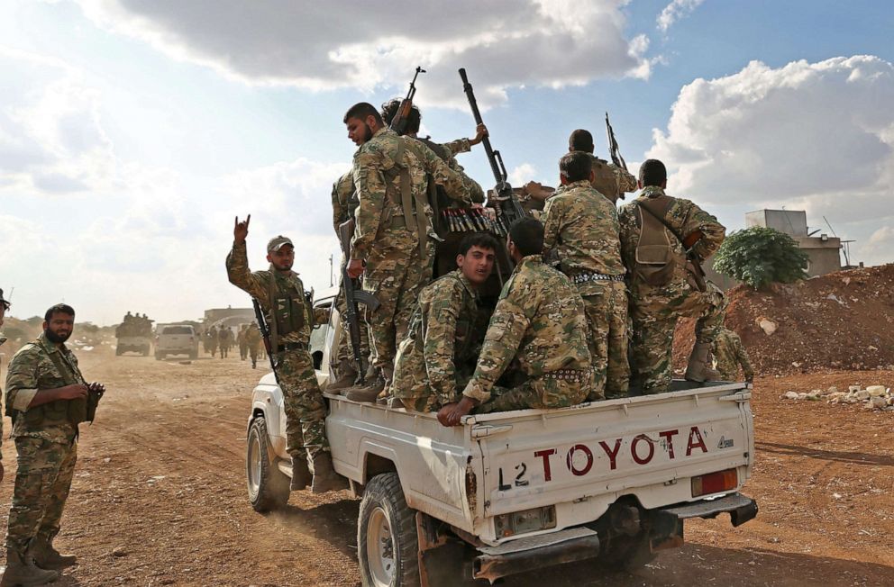 PHOTO: Turkish-backed Syrian fighters gather near the Syrian-Turkish border north of Aleppo on Oct. 7, 2019.