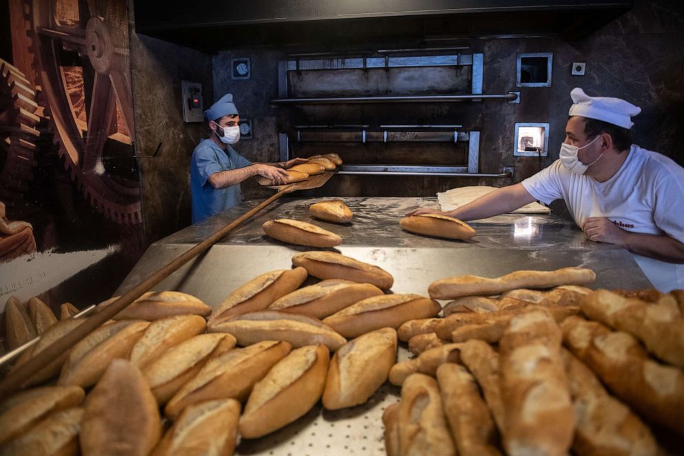 PHOTO: Employees bake bread at a bakery on March 23, 2022 in Istanbul, Turkey. In 2021, Turkey's wheat imports from Ukraine and Russia reached record levels.
