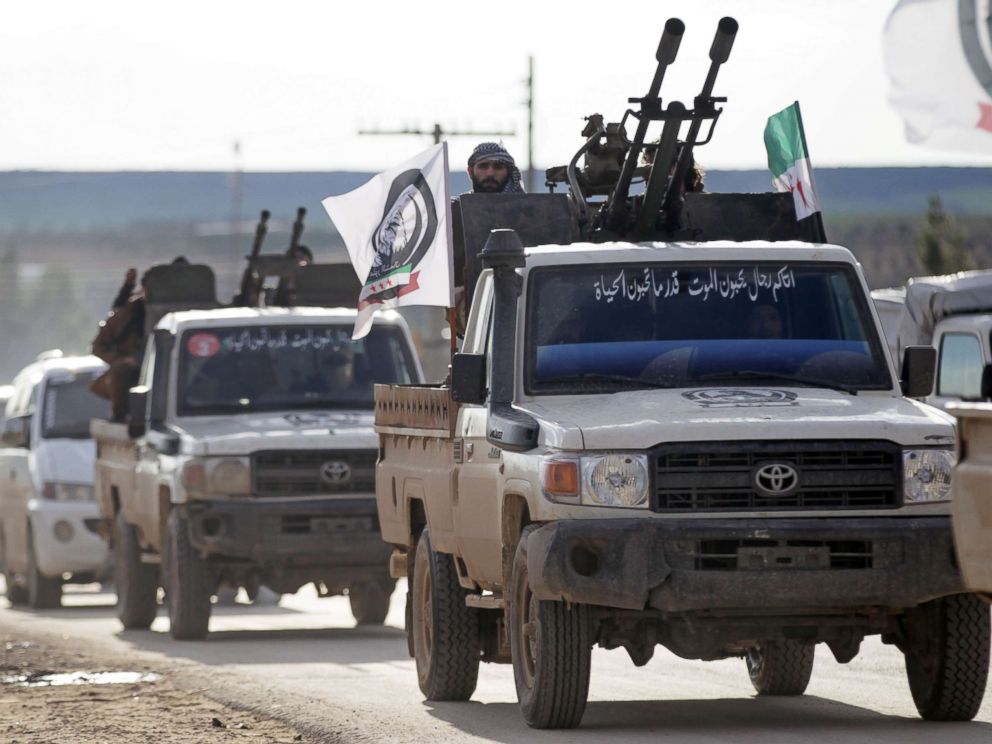 PHOTO: A Turkish-backed Syrian rebel rides on a truck with a mounted weapon in the Manbij countryside, Syria, Dec. 28, 2018.
