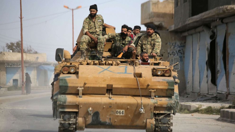 PHOTO: Turkish-backed Syrian fighters are pictured in the town of Ayn al-Arus, south of the border town of Tal Abyad, on Oct. 14, 2019.