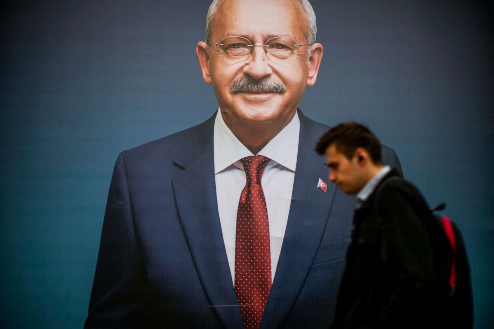 PHOTO: A man walks past a billboard of Turkish CHP party leader and Nation Alliance's presidential candidate Kemal Kilicdaroglu a day after the presidential election day, in Istanbul, Turkey, May 15, 2023.