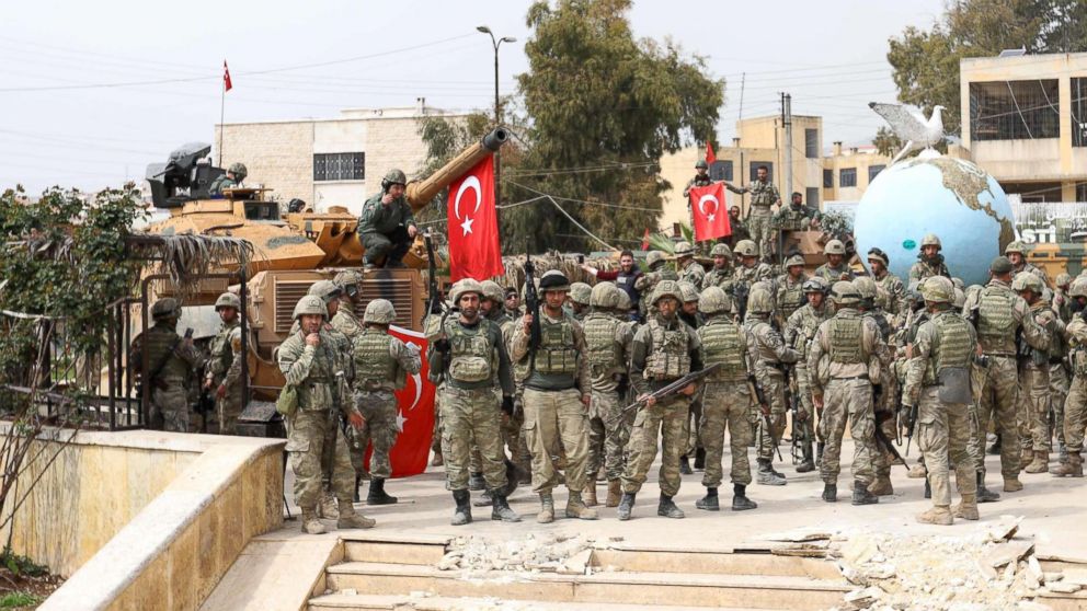 Turkish soldiers gather in the Kurdish-majority city of Afrin in northwestern Syria after seizing control of it from Kurdish People's Protection Units on March 18, 2018.