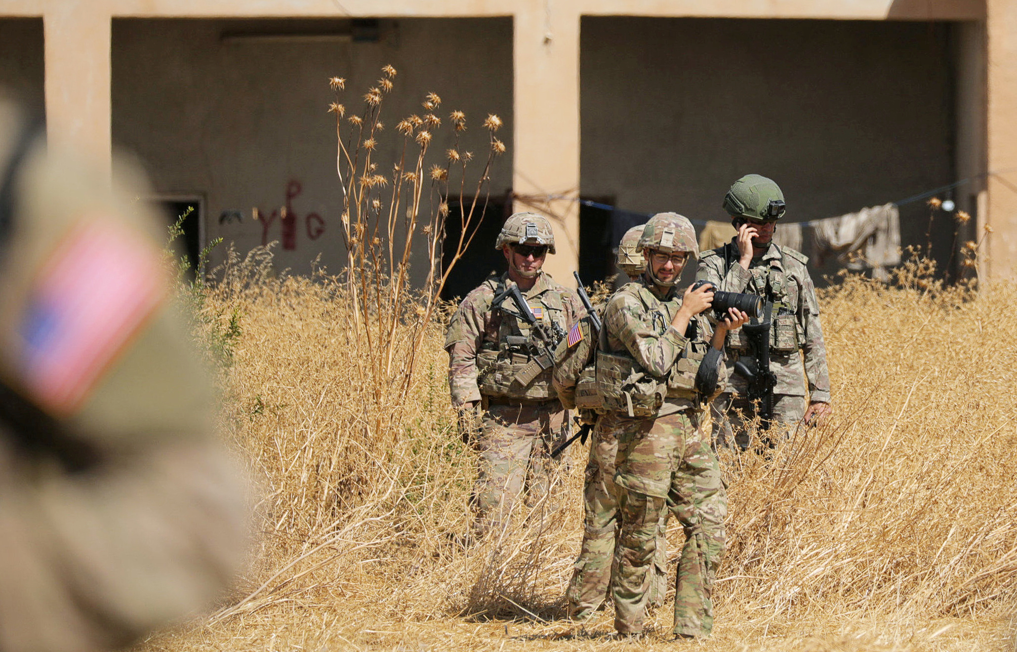 PHOTO: Turkish and American soldiers stand near a former YPG military point during a joint U.S.-Turkey patrol, near Tel Abyad, Syria, on Sept. 8, 2019.