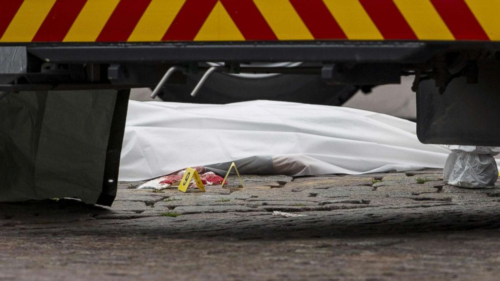 PHOTO: A stabbing victim's body lies covered in a sheet at the Turku Market Square in the Finnish city of Turku where several people were stabbed on Aug. 18, 2017.