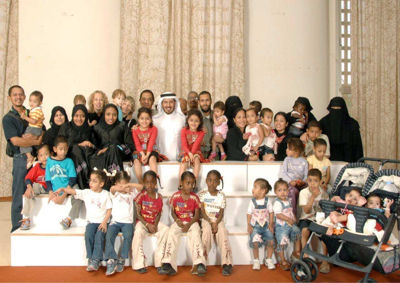 PHOTO: Dr. Abdullah al Rabeeah poses with a multinational grouping of conjoined twins he has operated on in 2010.