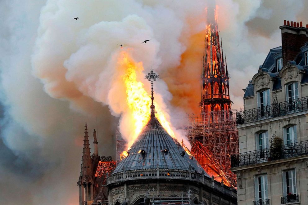 PHOTO: Smoke and flames rise during a fire at the landmark Notre Dame Cathedral in central Paris, April 15, 2019, potentially involving renovation works being carried out at the site, the fire service said. 