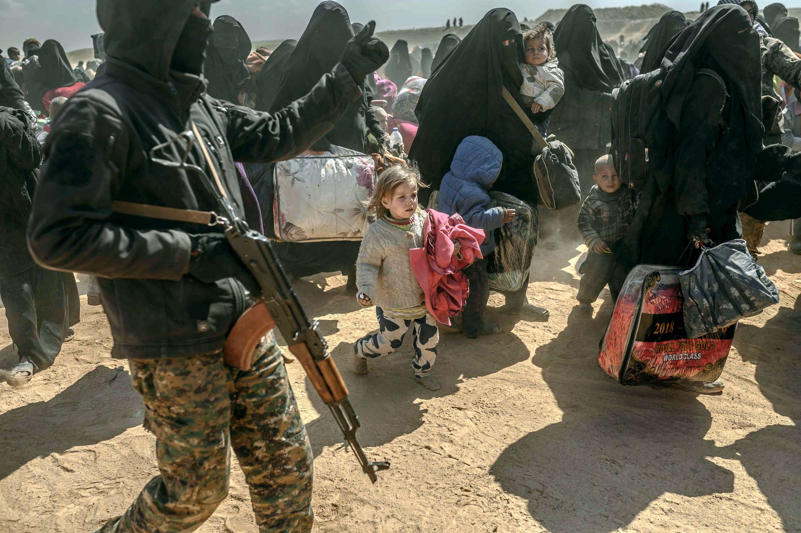 PHOTO: Women and children, evacuated from the Islamic State group's embattled holdout of Baghouz, arrive at a screening area held by the US-backed Kurdish-led Syrian Democratic Forces in Deir Ezzor, Syria, March 6, 2019.