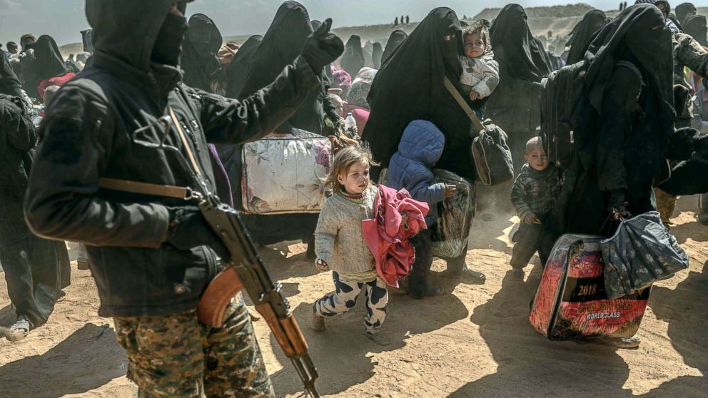 PHOTO: Women and children, evacuated from the Islamic State group's embattled holdout of Baghouz, arrive at a screening area held by the US-backed Kurdish-led Syrian Democratic Forces in Deir Ezzor, Syria, March 6, 2019.