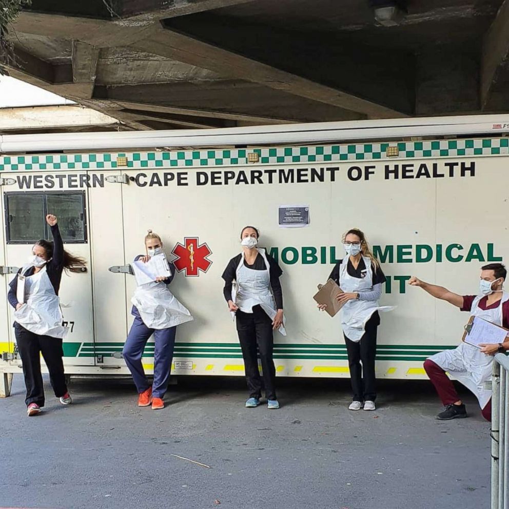 Patsy Oosthuizen (left) and Ingrid Hartmann (center) pose for a photo with other student volunteers outside Tygerberg Hospital's coronavirus screening area in Cape Town, South Africa, on April 5, 2020.Courtesy Patsy Oosthuizen