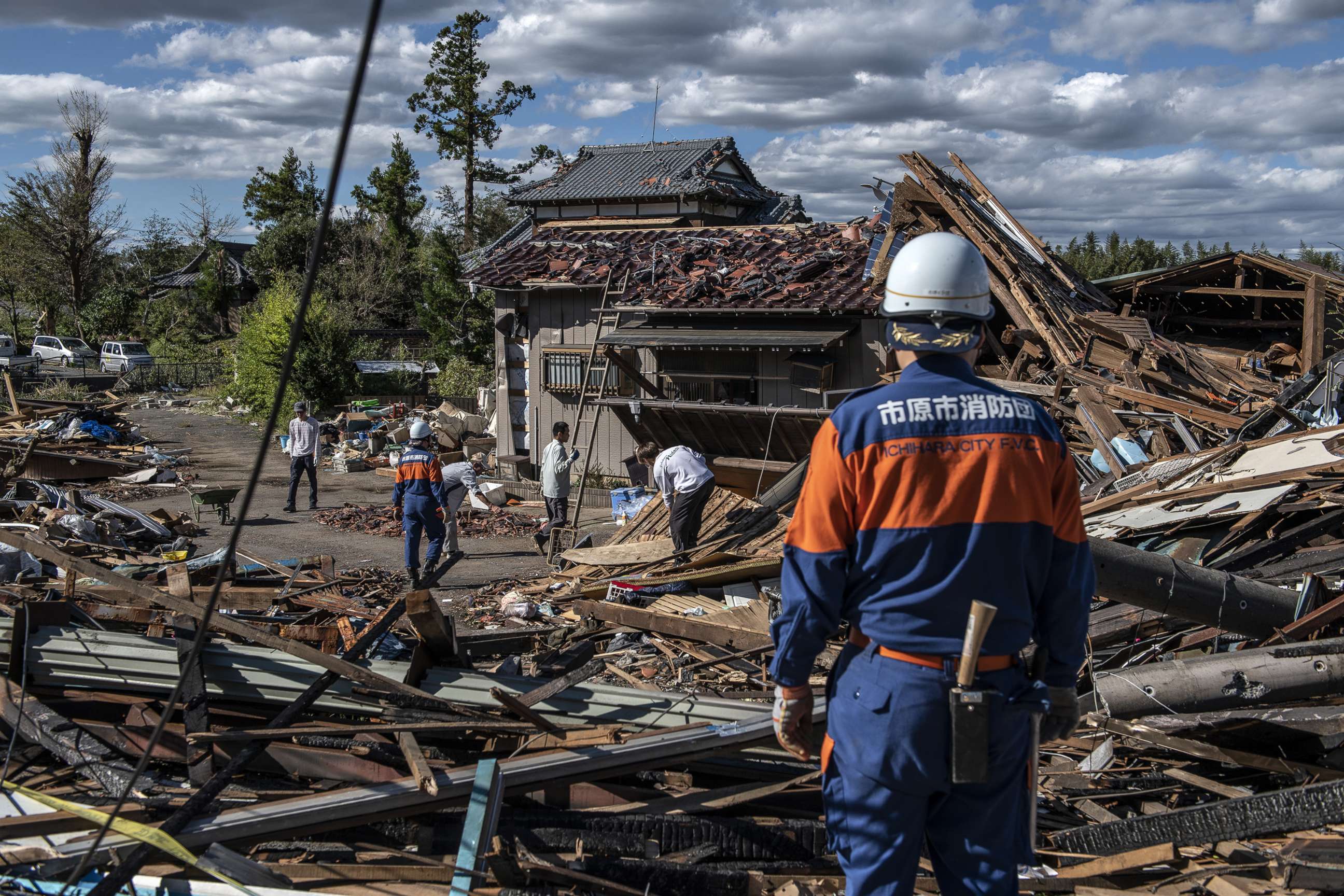PHOTO: Search and rescue crews sort through the debris of a building destroyed by a tornado shortly before the arrival of Typhoon Hagibis, Oct. 13, 2019, in Chiba, Japan.