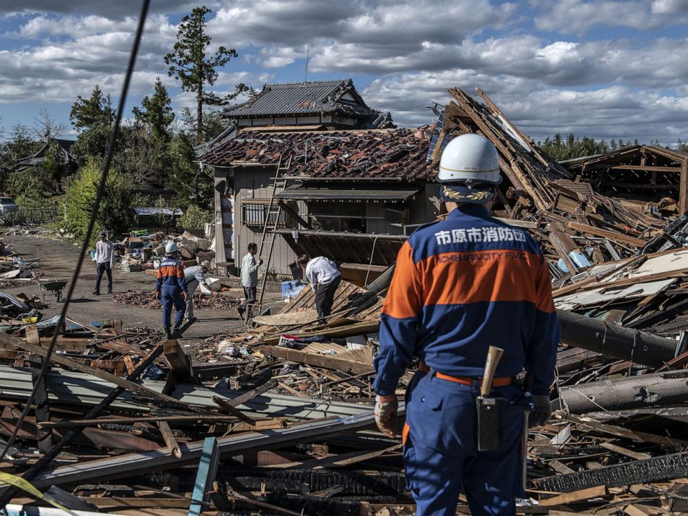 PHOTO: Search and rescue crews sort through the debris of a building destroyed by a tornado shortly before the arrival of Typhoon Hagibis, Oct. 13, 2019, in Chiba, Japan.