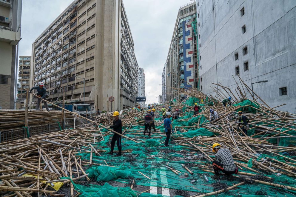PHOTO: Workers clear remnants of scaffolding tossed by Typhoon Mangkhut, Sept. 17, 2018, in Hong Kong.