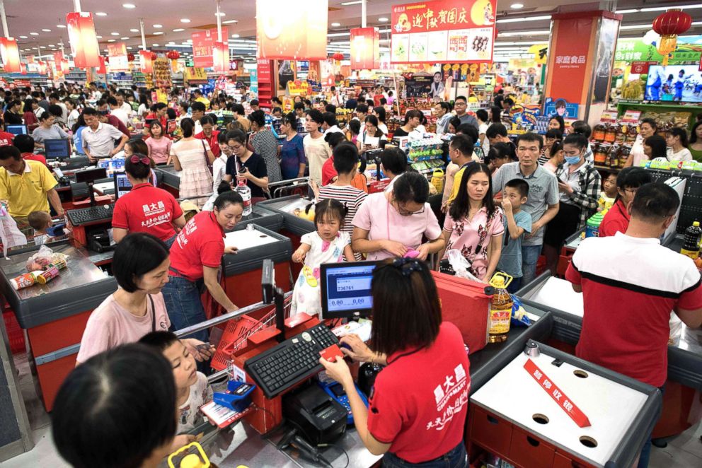PHOTO: People buy water and food at a supermarket ahead of the arrival of the Super Typhoon Mangkhut in Zhanjiang in Guangdong province, Sept. 15, 2018.