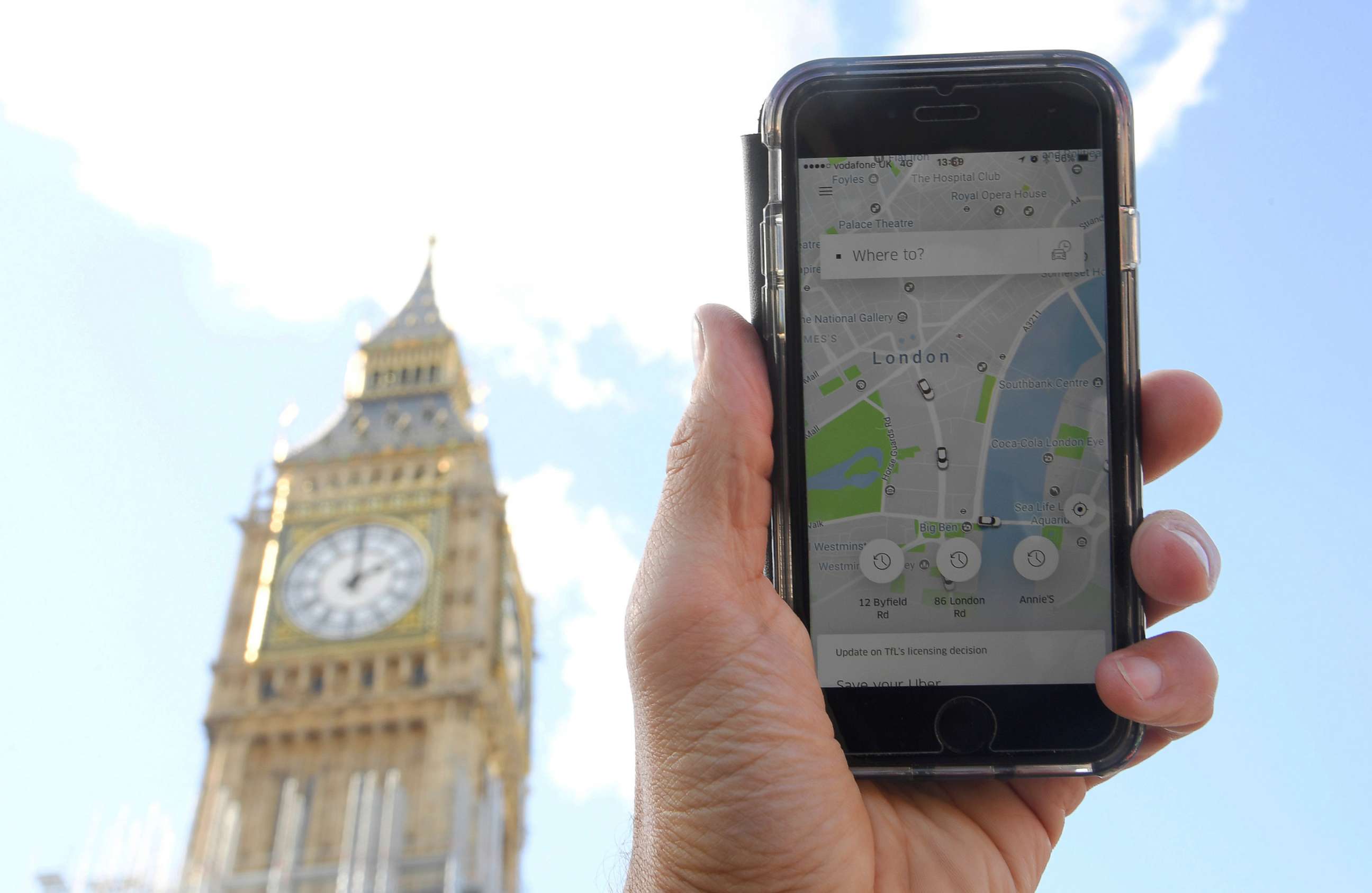 PHOTO: A photo illustration shows the Uber app on a mobile telephone, as it is held up for a posed photograph in central London, Sept. 22, 2017. 