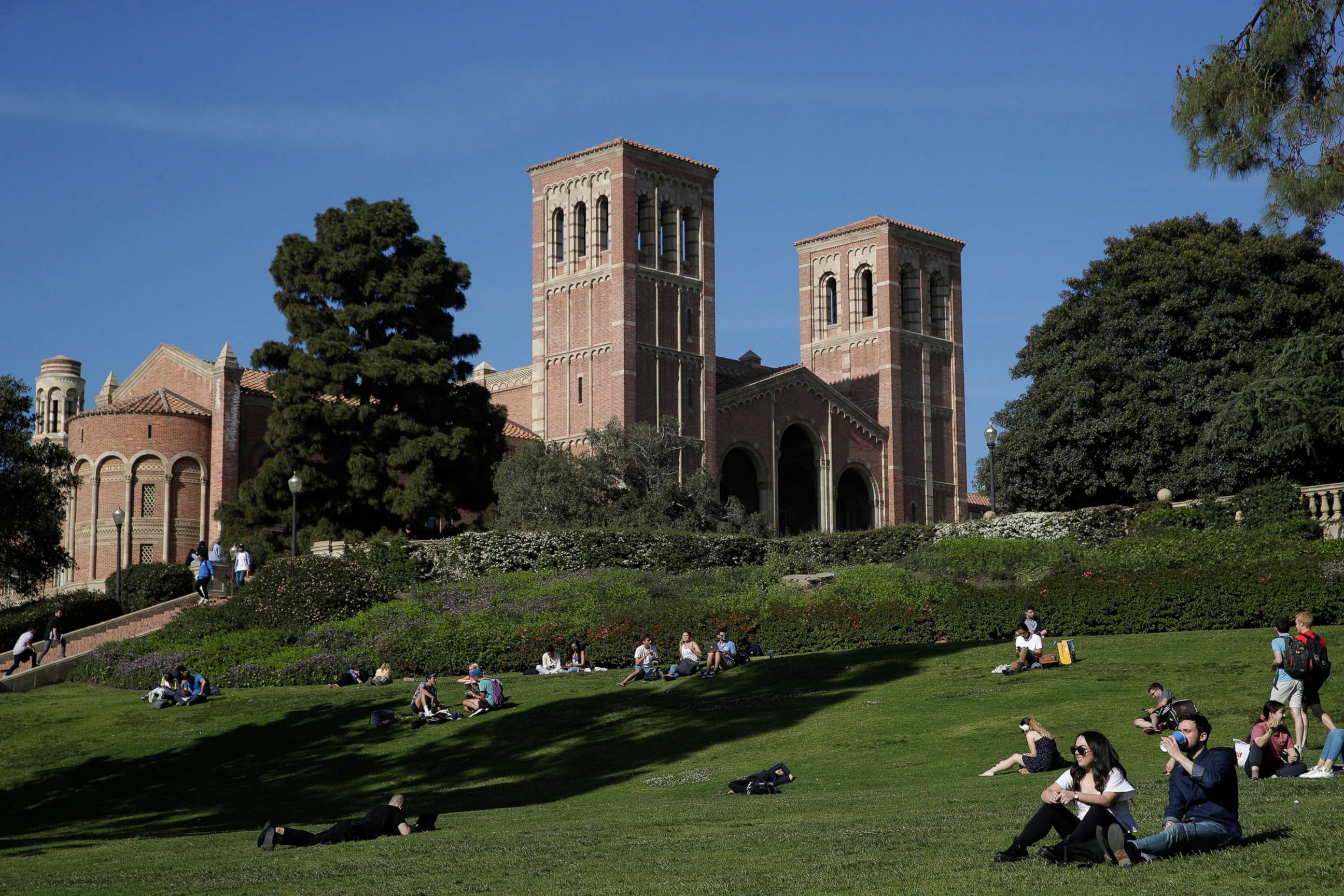 PHOTO: In this April 25, 2019, file photo, students sit on the lawn near Royce Hall at UCLA, in the Westwood section of Los Angeles.