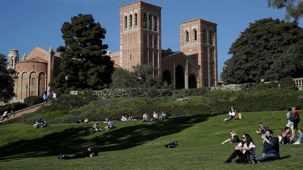 PHOTO: In this April 25, 2019, file photo, students sit on the lawn near Royce Hall at UCLA, in the Westwood section of Los Angeles.