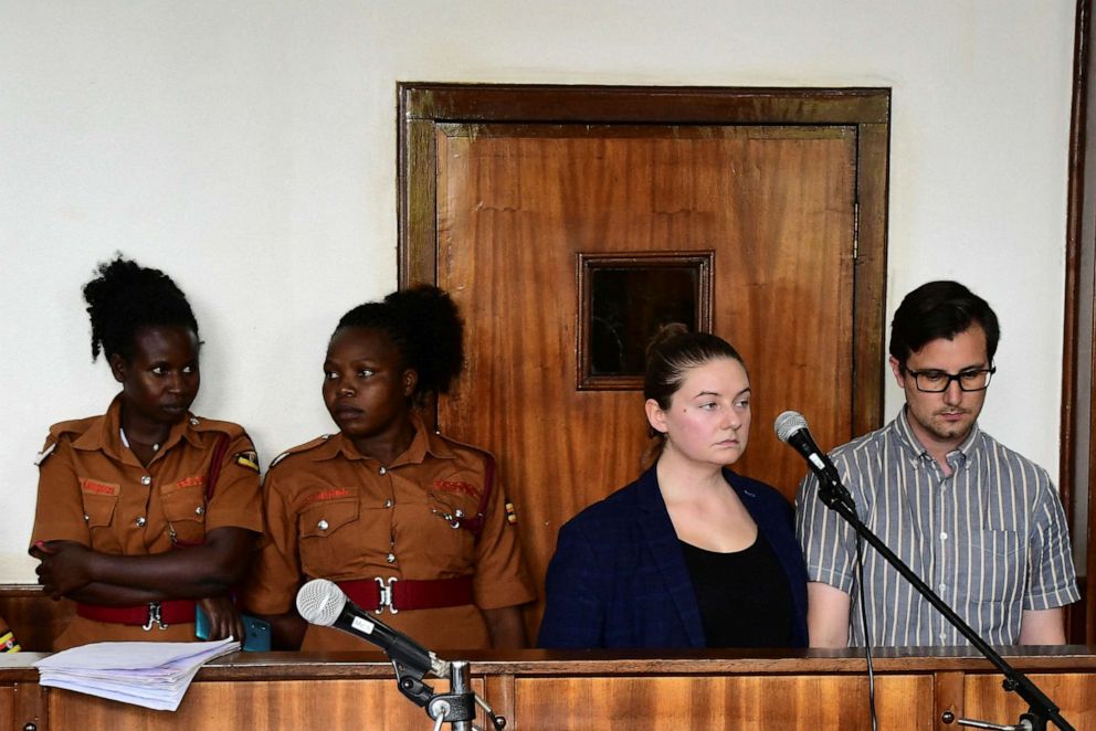 PHOTO: American couple Nicholas Spencer and Mackenzie Leigh Mathias Spencer, both 32, stand in the dock at Buganda road court, where they were charged with torturing a 10-year-old, in Kampala, Uganda, on Dec. 14, 2022.