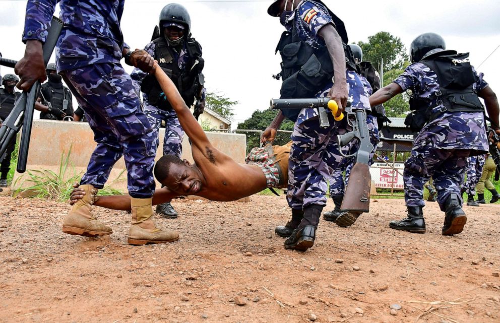 PHOTO: Ugandan riot police detain a supporter of presidential candidate Robert Kyagulanyi, also known as Bobi Wine, in Luuka district, eastern Uganda, on Nov. 18, 2020.