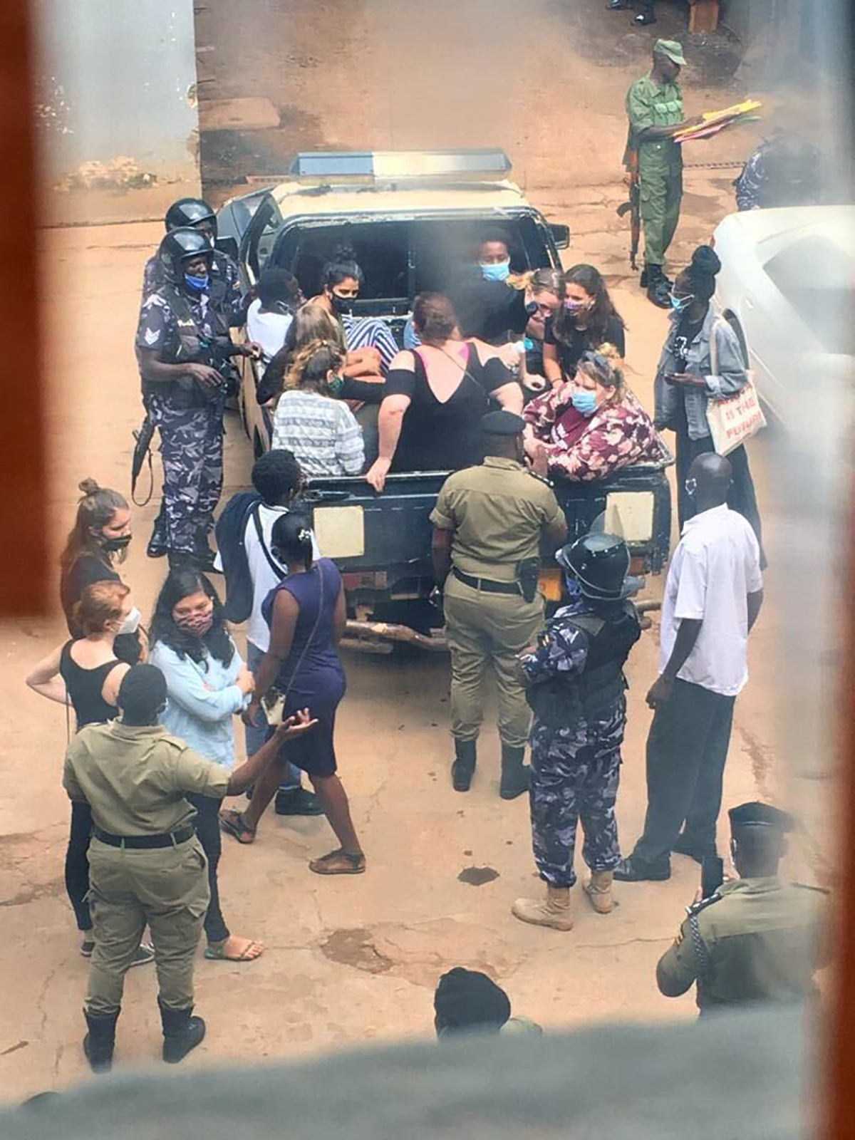 PHOTO: Protesters are arrested and placed in the back of a police truck during an anti-racism demonstration in Kampala, Uganda, on June 9, 2020.
