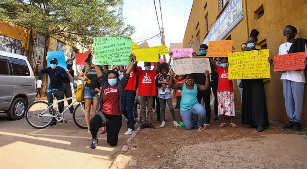 PHOTO: Protesters pose for a photo during a rally against racism and police brutality in Kampala, Uganda, on June 9, 2020, in the wake of the death of George Floyd.