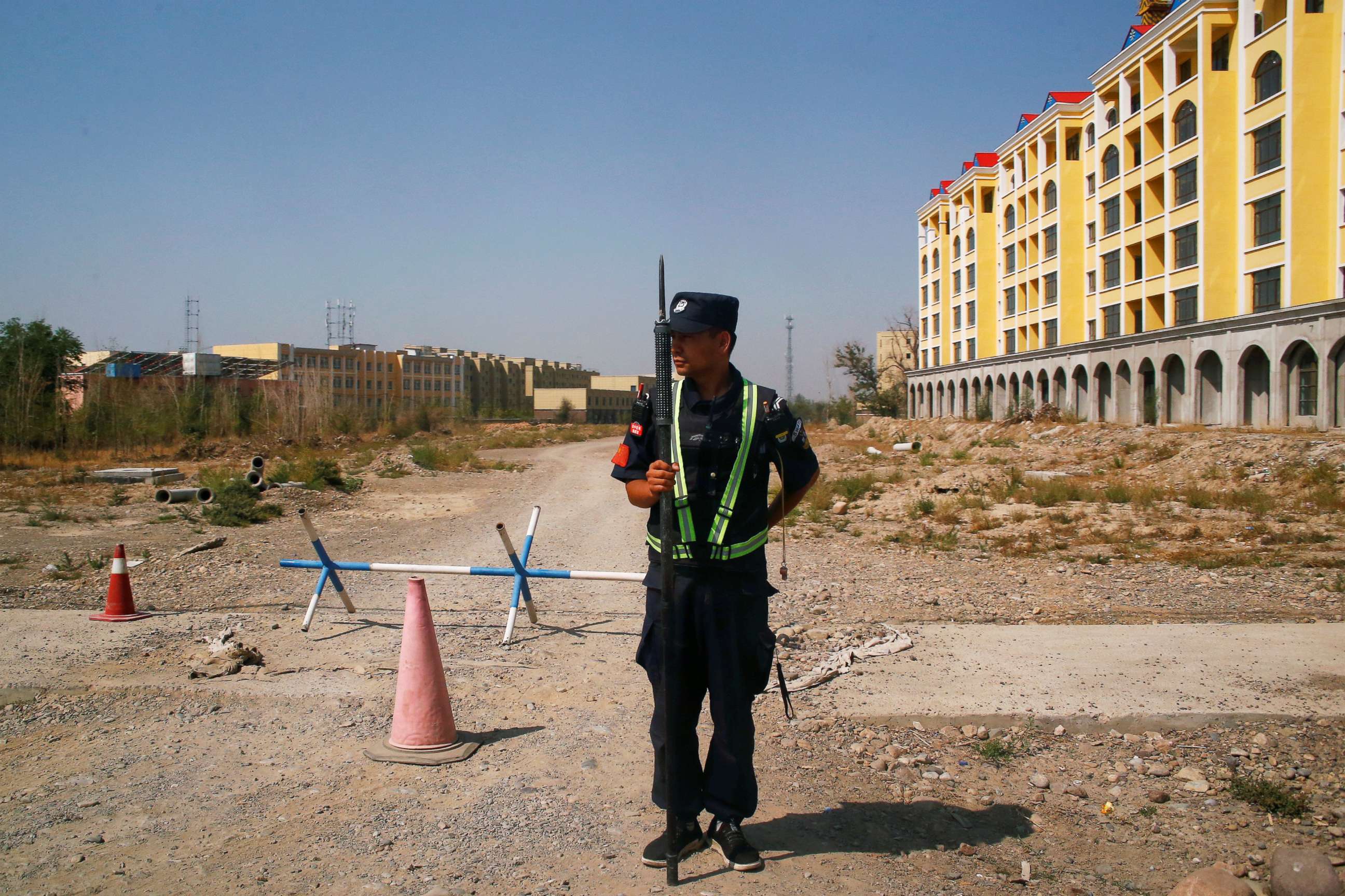PHOTO: A Chinese police officer takes his position by the road near what is officially called a vocational education centre in Yining in Xinjiang Uighur Autonomous Region, China, Sept. 4, 2018.