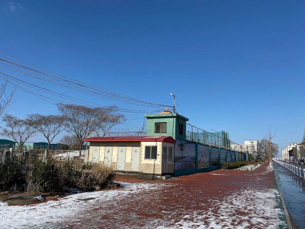 PHOTO: In this Jan. 8, 2020, file photo, the fences along the side of the Qingdao Taekwang Shoes Co. factory, the side where the Uighur workers enter and exit, and live in dorms, looks almost like a prison, in Laixi, China.