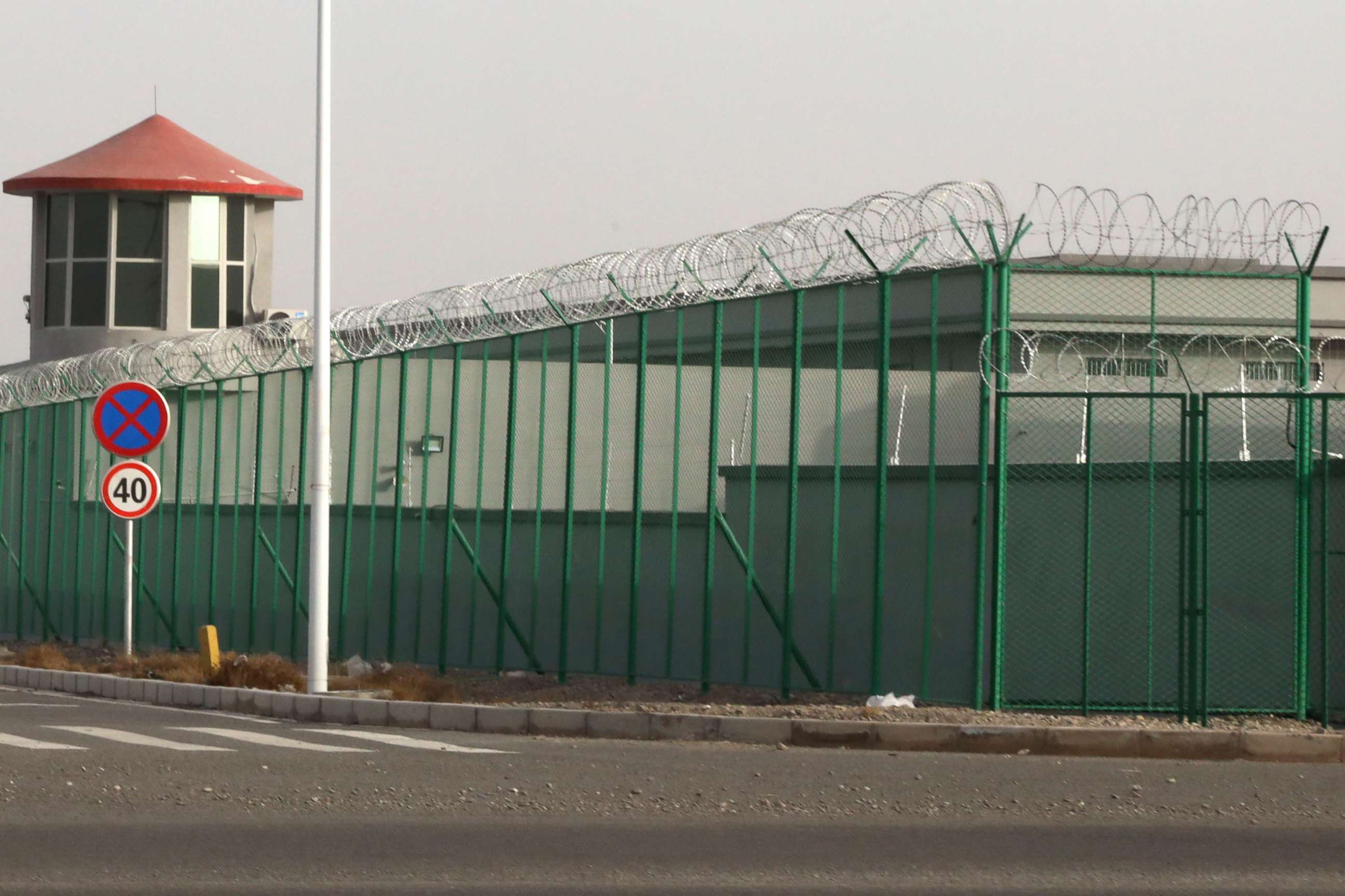 PHOTO: In this Dec. 3, 2018, file photo, a guard tower and barbed wire fence surround a detention facility in the Kunshan Industrial Park in Artux in western China's Xinjiang region.