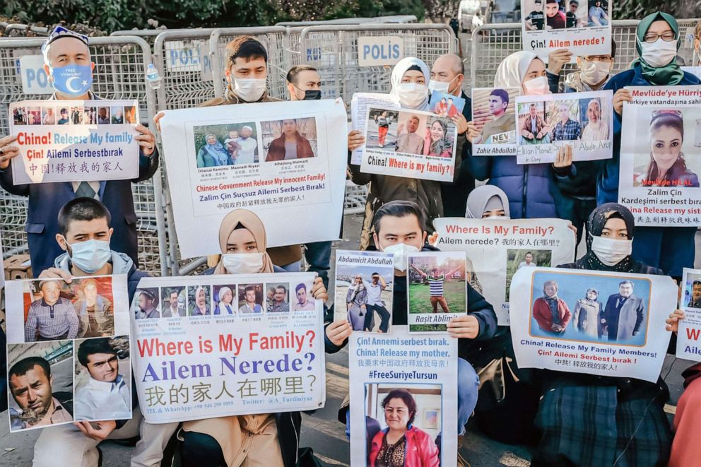 PHOTO: Members of the Muslim Uighur minority hold placards as they demonstrate in front of the Chinese consulate on Dec. 30, 2020, in Istanbul to ask for news of relatives and to express concern after China announced an extradition treaty with Turkey.