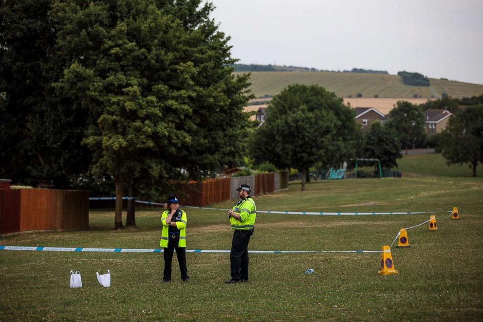 PHOTO: Police officers stand at a cordon around an area of grass near to Amesbury Baptist Centre as Wiltshire Police declare a major incident after a man and woman were exposed to an unknown substance, July 4, 2018, in Amesbury, England.