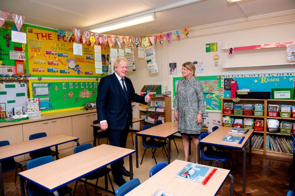 PHOTO: U.K. Prime Minister Boris Johnson (left) talks with head teacher Bernadette Matthews as he visits St. Joseph's Catholic Primary School in Upminster, East London, on Aug. 10, 2020.