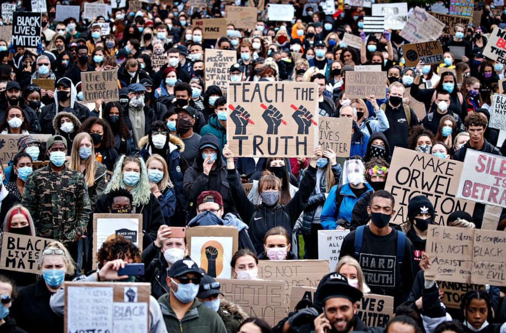 PHOTO: People take part in a Black Lives Matter protest rally in Piccadilly Gardens, Manchester, England, June 6, 2020.