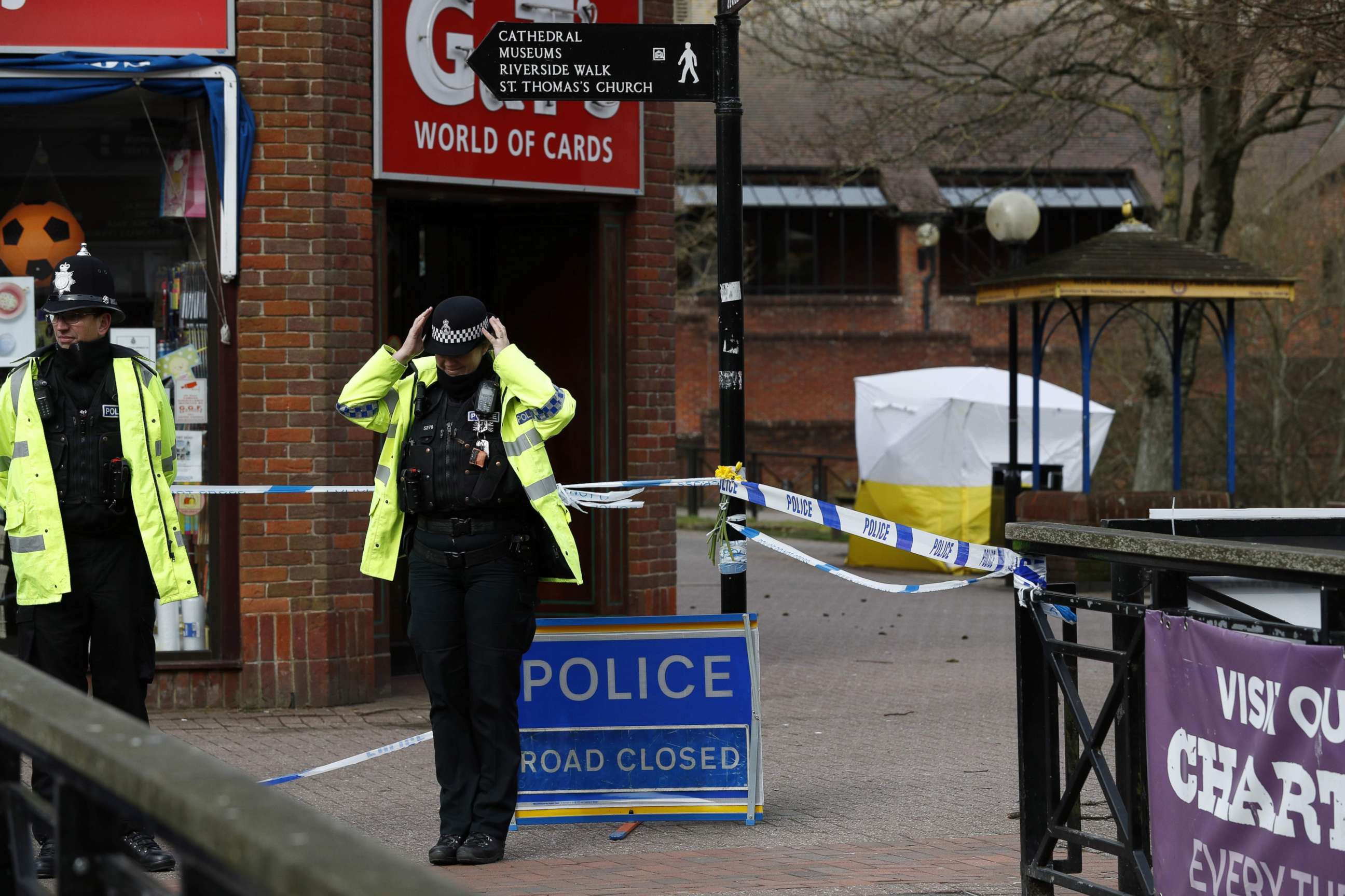 PHOTO: Police officers stand on duty near bench covered in a protective tent at The Maltings shopping centre in Salisbury, southern England, on March 14, 2018.