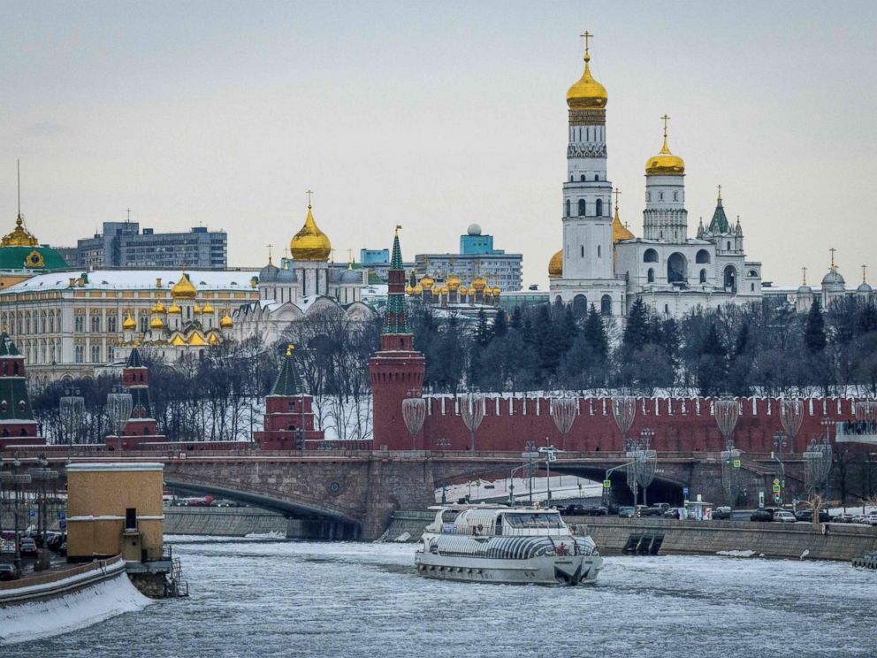 PHOTO: A tourist boat breaks through the frozen Moskva river outside the Kremlin in Moscow on March 13, 2018.