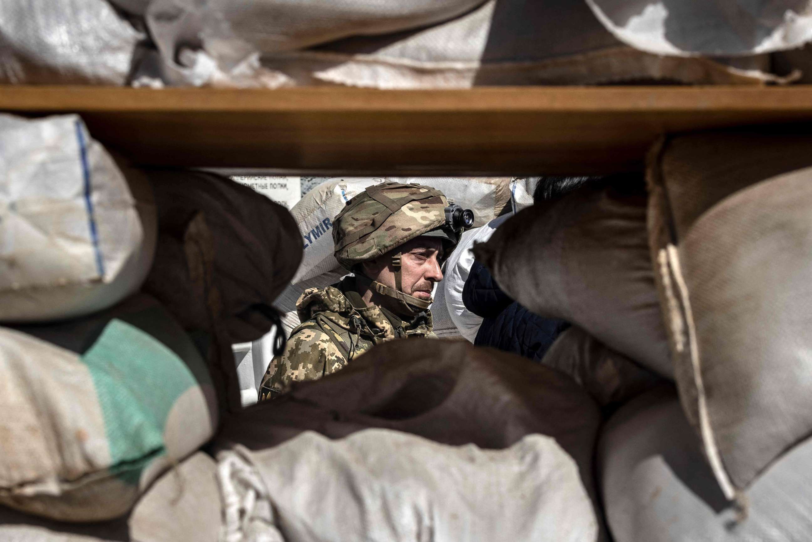 PHOTO:A Ukrainian serviceman guards a military check point in the city of Zhytomyr, northern Ukraine, March 23, 2022. 