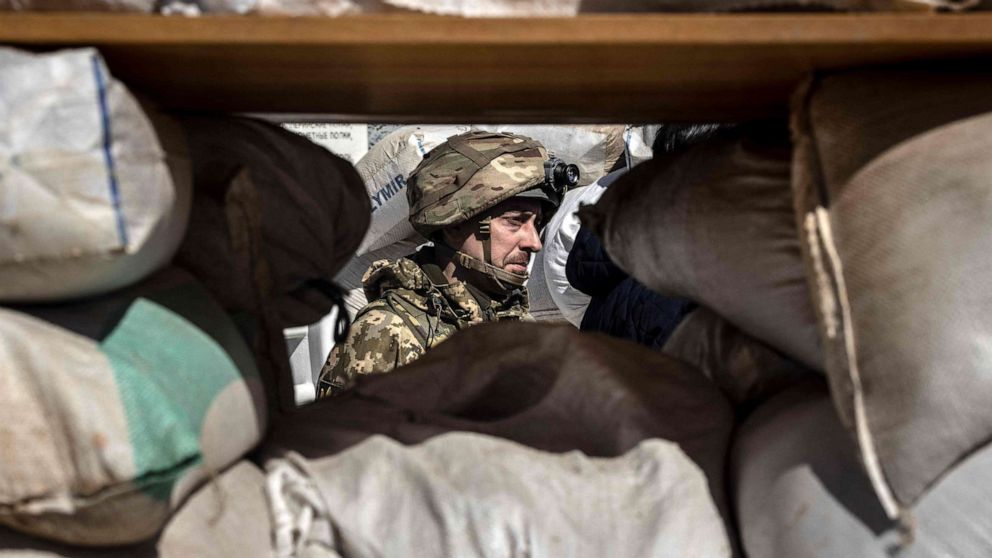 PHOTO:A Ukrainian serviceman guards a military check point in the city of Zhytomyr, northern Ukraine, March 23, 2022. 