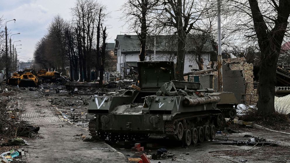 PHOTO: Destroyed Russian armored vehicles lie on a road in the city of Bucha, west of Kyiv, on March 4, 2022. 