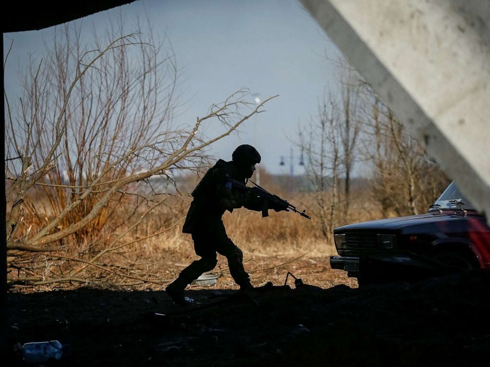 PHOTO: A member of the Ukrainian forces takes a position, amid Russia's invasion of Ukraine, in Irpin, Ukraine March 12, 2022. REUTERS/Gleb Garanich
